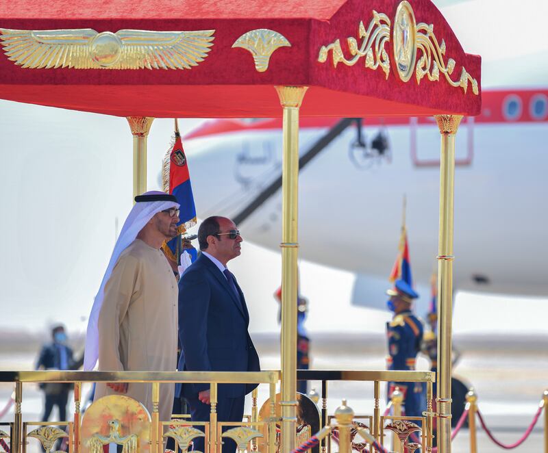 Sheikh Mohamed and Abdel Fattah El Sisi stand for the national anthem at Al Alamein.  