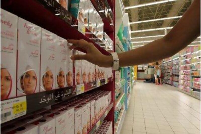 Rows of Fair & Lovely face whitening cream for sale in a Dubai hypermarket.