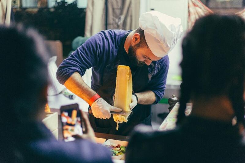  Samer Khaizaran, partner of Raclette DXB, serves at the opening of Street Food Market DXB at the Dubai International Marine Club. Courtesy Street Food Market DXB
