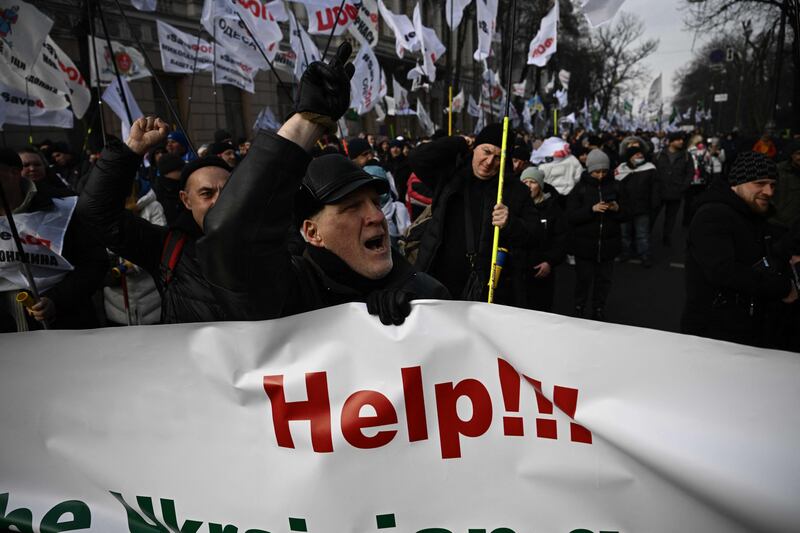 A protester shouts slogans during a demonstration outside the Ukrainian parliament in Kiev against high government taxes. AFP