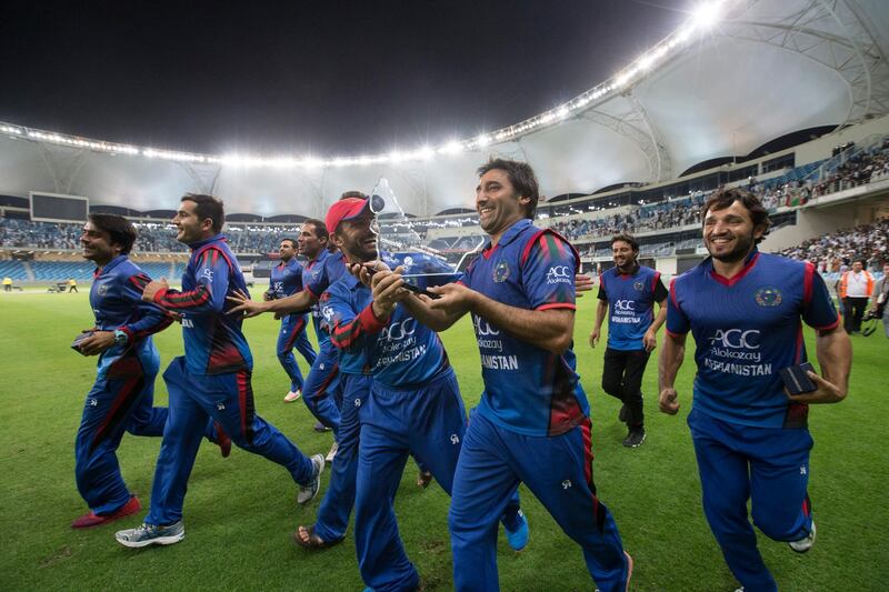 200117-CRICKET-RP - Afghanistan team walking with their trophy at Desert Twenty 20 Cricket Tournament Ireland vs Afghanistan at Dubai International Cricket Stadium on Friday, 20 January 2017.  Photo by Ruel Pableo / The National *** Local Caption ***  Creckit RP - Afghanistan vs Ireland13.jpg