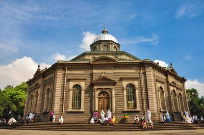 St George Church is an Orthodox cathedral in Addis Ababa, Ethiopia. It has distinctive octagonal form.Everyday, but especially on sunday the believers are gathering and praying in and outside around the church. Women and girls are covering their heads and shoulders with white scarfs. Getty Images