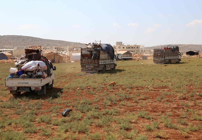 Displaced Syrians arrive at a camp in Kafr Lusin near the border with Turkey in the northern part of Syria's rebel-held Idlib. AFP