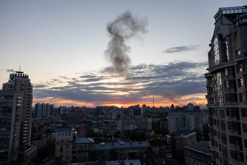 Smoke rises after an explosion at sunset in Kyiv. Getty Images