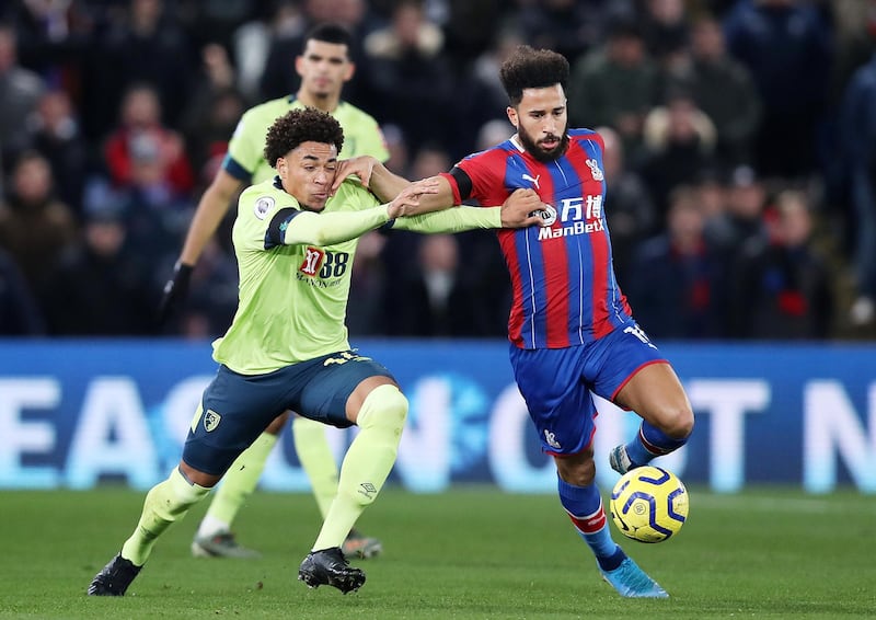 LONDON, ENGLAND - DECEMBER 03: Andros Townsend of Crystal Palace (R) holds off Arnaut Danjuma of AFC Bournemouth during the Premier League match between Crystal Palace and AFC Bournemouth at Selhurst Park on December 03, 2019 in London, United Kingdom. (Photo by Jack Thomas/Getty Images)
