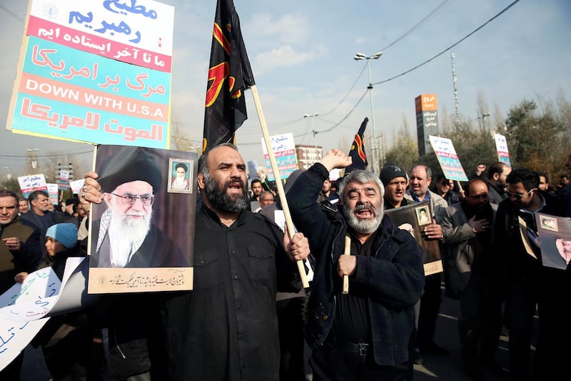 Demonstrators react during a protest against the assassination of Suleimani and Iraqi militia commander Abu Mahdi al-Muhandis in Tehran. Reuters