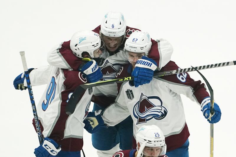 Kadri celebrates with his teammates after scoring a goal in overtime against the Tampa Bay Lightning. AP