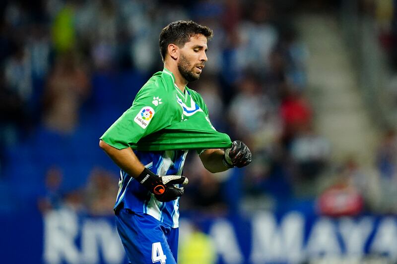 Espanyol's Leandro Cabrera puts on the goalkeeper's jersey to replace Benjamin Lecomte after he received a red card. AP
