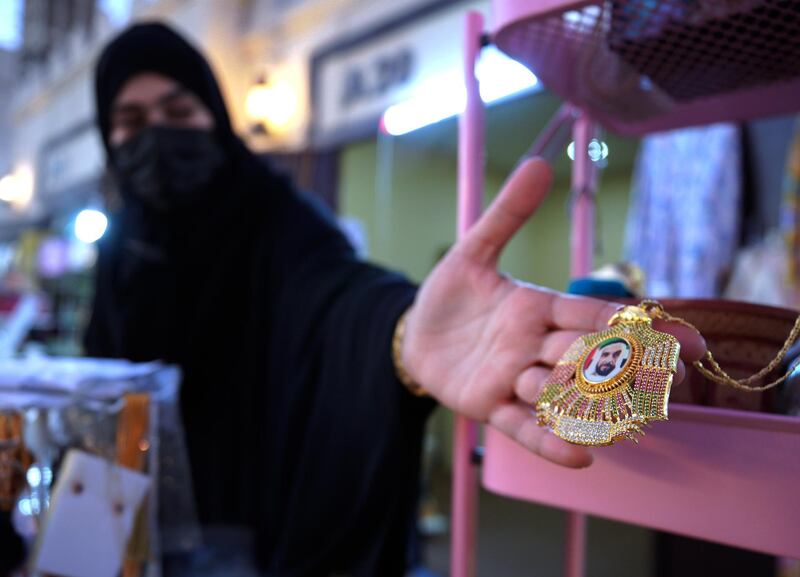 Abu Dhabi, United Arab Emirates, January 10, 2021.  Mariam Al Shehi displays a Sheikh Zayed medallion at the Middle Eastern market at Sheikh Zayed Festival.
Victor Besa/The National
Section:  NA
Reporter:  Saeed Saeed