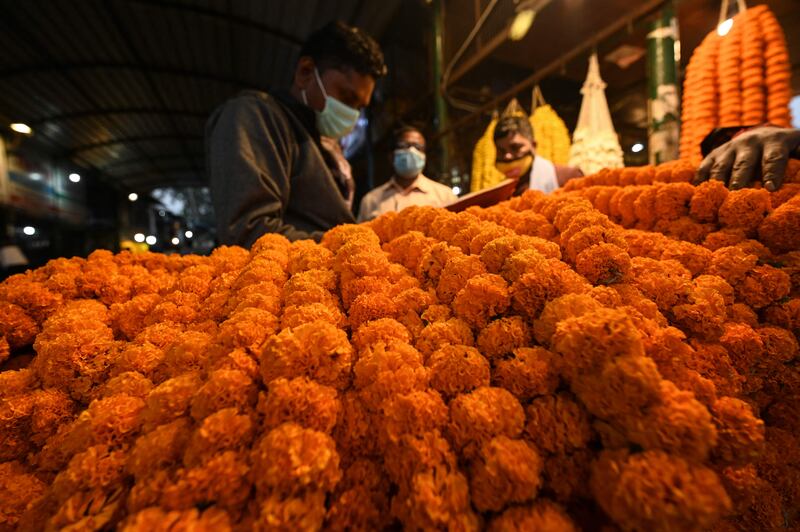 Flower garlands at a shop in New Delhi. AFP