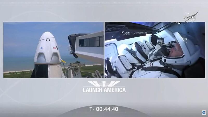 In this still image taken from NASA TV, NASA astronauts Bob Behnken (rear) and Doug Hurley are strapped in the SpaceX Crew Dragon capsule at Kennedy Space Center in Florida as the crew access arm retract (L) for their launch to the International Space Station on May 30, 2020. The mission, dubbed "Demo-2," is the final test flight before NASA certifies the SpaceX spacecraft for regular crewed missions. - RESTRICTED TO EDITORIAL USE - MANDATORY CREDIT "AFP PHOTO / NASA TV" - NO MARKETING - NO ADVERTISING CAMPAIGNS - DISTRIBUTED AS A SERVICE TO CLIENTS
 / AFP / NASA TV / - / RESTRICTED TO EDITORIAL USE - MANDATORY CREDIT "AFP PHOTO / NASA TV" - NO MARKETING - NO ADVERTISING CAMPAIGNS - DISTRIBUTED AS A SERVICE TO CLIENTS
