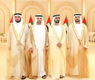 This handout picture provided by the UAE Ministry of Presidential Affairs on June 6, 2019 shows, Ruler of Dubai Sheikh Mohammed bin Rashid Al-Maktoum (2nd R), posing for a photograph with his sons, Crown Prince Sheikh Hamdan bin Mohammed (2nd L), Sheikh Maktoum bin Mohammed, (R), and Sheikh Ahmed bin Mohammed, on their wedding day in Dubai. (Photo by - / UAE Ministry of Presidential Affairs / AFP) / XGTY / RESTRICTED TO EDITORIAL USE - MANDATORY CREDIT "AFP PHOTO / UAE MINISTRY OF PRESIDENTIAL AFFAIRS - NO ADVERTISING CAMPAIGNS - DISTRIBUTED AS A SERVICE TO CLIENTS