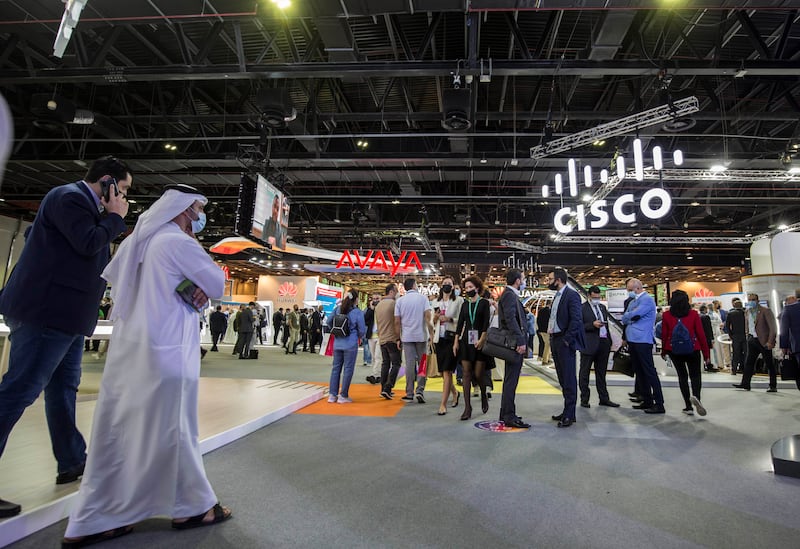 Visitors explore the tech stands in the Dubai World Trade Centre.