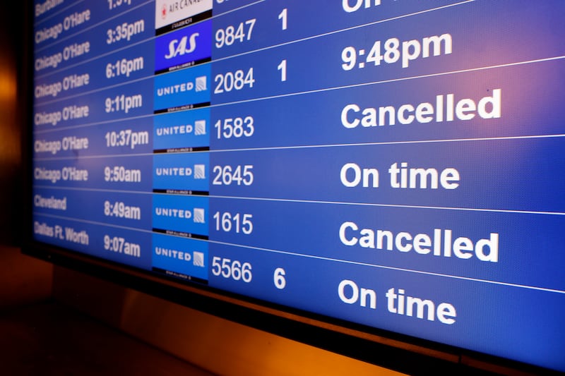 A screen  at the San Francisco International Airport shows cancelled United Airlines flights to Chicago O'Hare and Cleveland on Christmas Eve. EPA