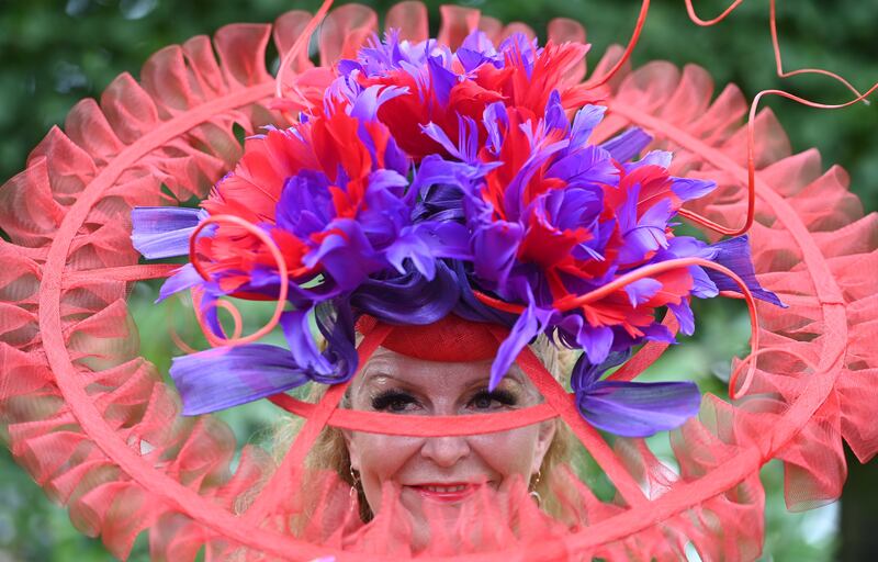 A race-goer wears an extravagant hat on ladies day of Royal Ascot. EPA