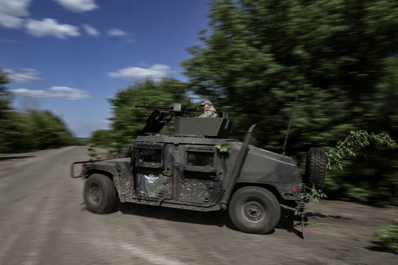 A Ukrainian army vehicle moves towards the front line at a checkpoint near Lysychansk. AFP