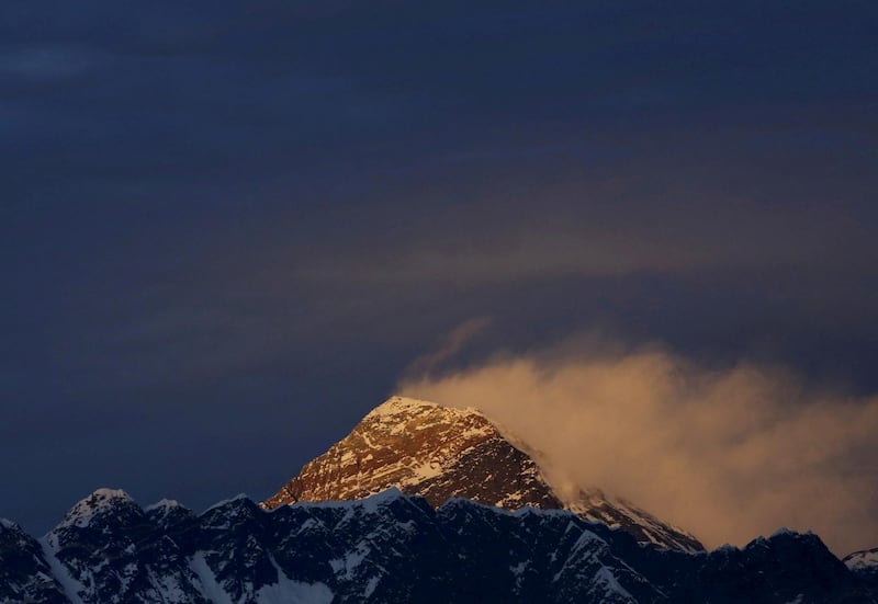 Light illuminates Mount Everest at sunset. Reuters