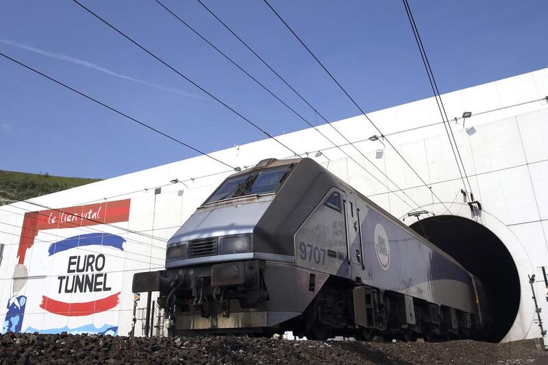 An Eurotunnel freight shuttle exits the Channel Tunnel in Coquelles, near Calais. The Channel Tunnel is 31.4 miles long, making it the 11th longest tunnel in use. Pascal Rossignol / Reuters
