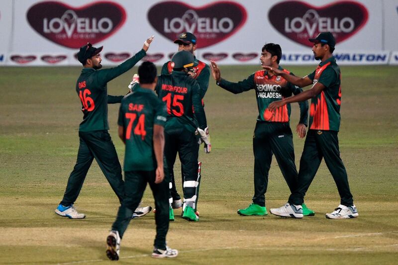 Bangladesh's wicketkeeper Mushfiqur Rahim (C) celebrates with his teammates after the dismissal of West Indies' Jahmar Hamilton during the third and final one-day international (ODI) cricket match between Bangladesh and West Indies at the Zohur Ahmed Chowdhury Stadium in Chittagong on January 25, 2021.  / AFP / Munir Uz zaman
