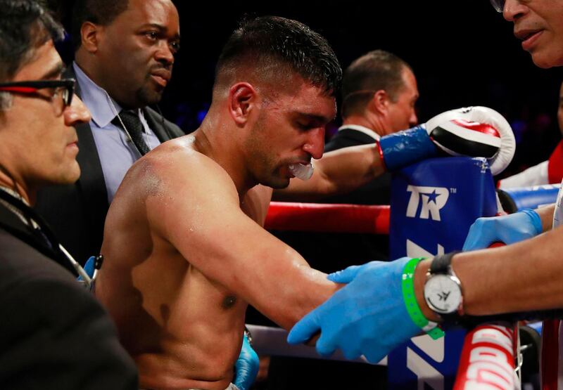 Amir Khan looks dejected after losing the fight. Action Images via Reuters