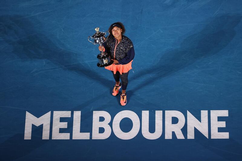 Naomi Osaka with the Daphne Akhurst Memorial Cup. Getty