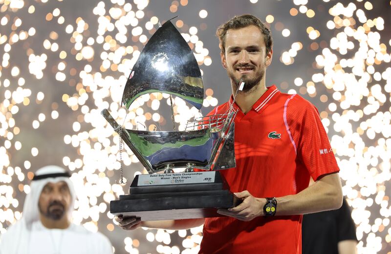 Daniil Medvedev poses with the Dubai Duty Free Tennis Championships trophy after beating Andrey Rublev in the final. EPA