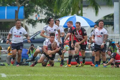 Ed Lewsey, playing his final match for UAE, offloads against Philippines in the Asia Rugby Championship Division 1 in Ipoh, Malaysia. Asia Rugby/Tigers Super Sports Media *** Local Caption ***  IMG_7067.jpg