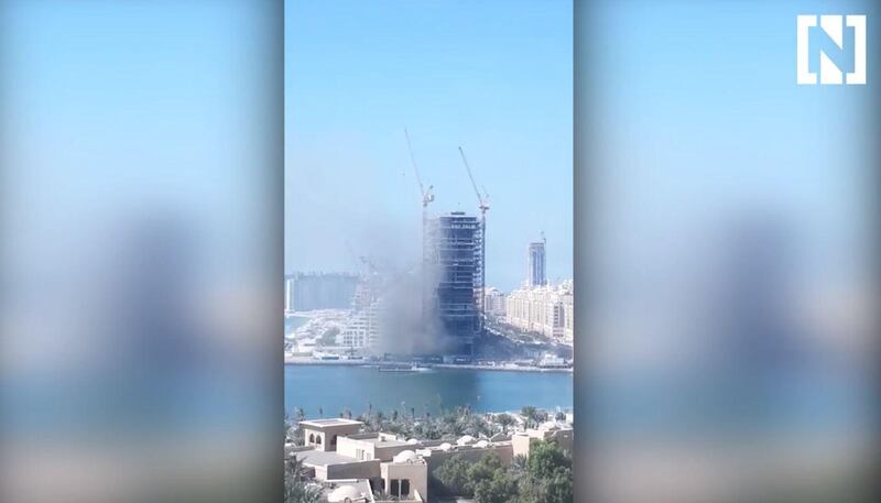 Smoke billows across Dubai's Palm Jumeirah, after a fire broke out near One Palm by Omniyat.