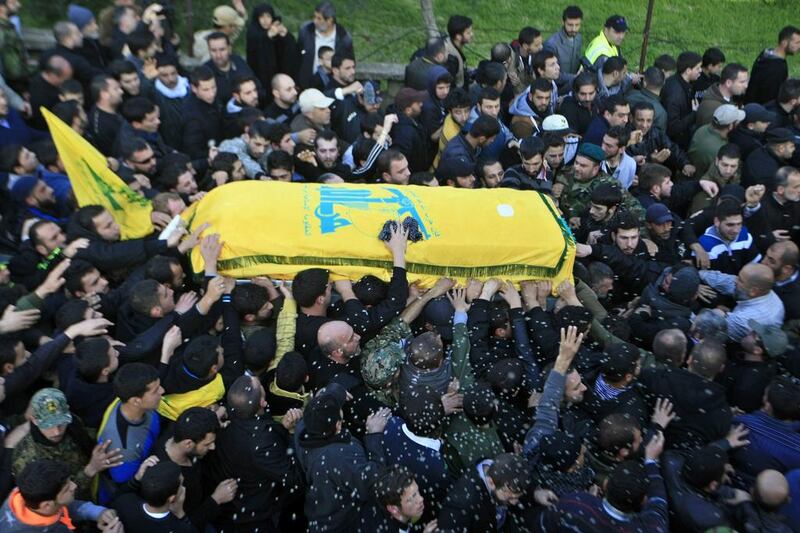 Hizbollah fighters carry the coffin of one of the six members killed in an Israeli airstrike. Photo: Mohammed Zaatari / AP