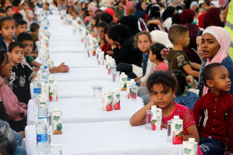 Orphans wait for their iftar meal during Jordan's largest charity event, organised by a society from the UAE for 4,000 children and held at Petra Stadium in Amman, Jordan May 24, 2019. Picture taken May 24, 2019. REUTERS/Muhammad Hamed
