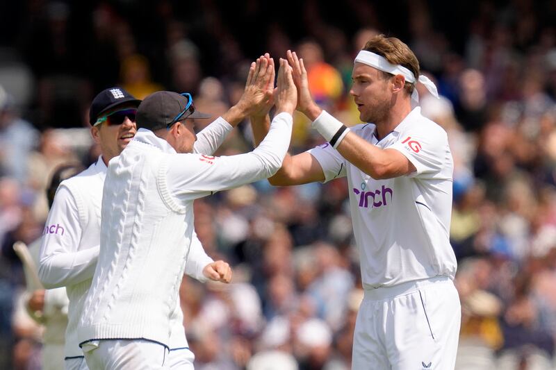 Stuart Broad celebrates taking the wicket of Daryl Mitchell for 108. AP