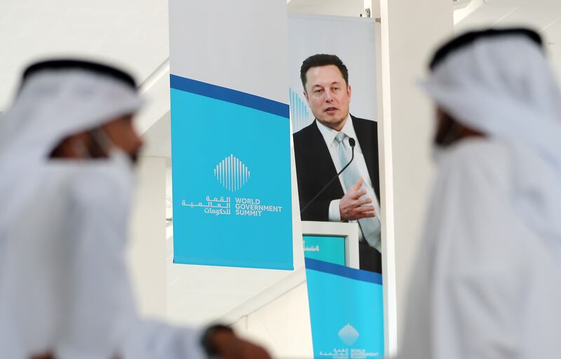 A poster shows Elon Musk, a speaker at a previous year's event. Pawan Singh / The National 