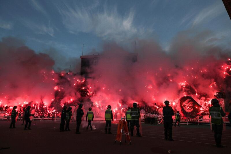 Supporters of FAR Rabat set off flares during their Moroccan football league match against rivals Raja Casablanca at the Stade Prince Moulay Abdallah, on Wednesday, February 12. AP
