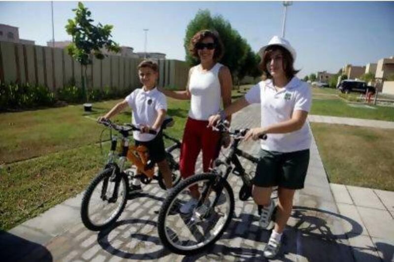 Mother-of-two Maridel Menino has brought her healthy attitude with her from Mexico. She ensures her two children Miguel Alvarez, 9, and Pamela Alvarez, 11, cycle to school in Khalifa City A each day. Sammy Dallal / The National