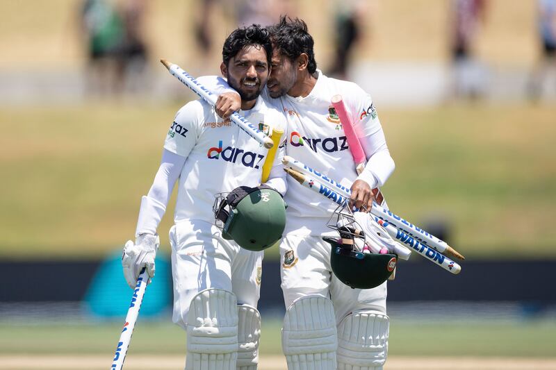 Bangladesh captain Mominul Haque, left, and teammate Mushfiqur Rahim walk from the field after their historic Test win against New Zealand at Bay Oval. AP