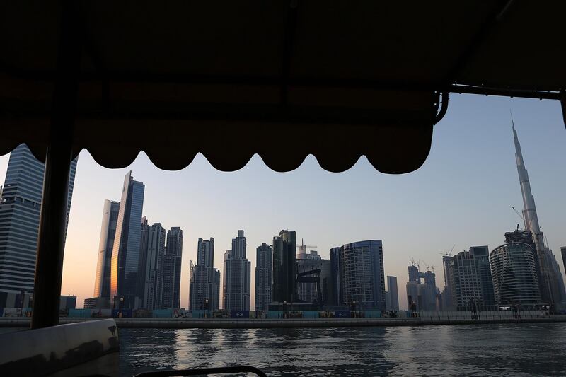 
DUBAI , UNITED ARAB EMIRATES – May 17 , 2017 : View of the Dubai Skyline from the Abra at Dubai Water Canal in Dubai. The ticket price for one trip is 25 AED per person and the total time of this ride is around 45 minutes. People can see the Burj Khalifa and other buildings from Abra during the ride. ( Pawan Singh / The National ) For News / Photo Feature. ID No :- 18945 *** Local Caption ***  PS1705- DUBAI CANAL19.jpg