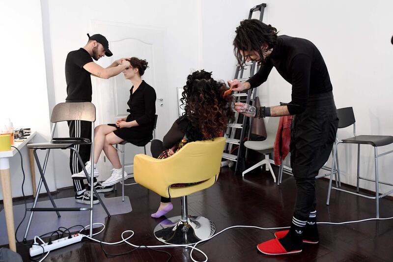 Models are prepared before a video and photo shoot to promote Roma fashion and identity. AFP