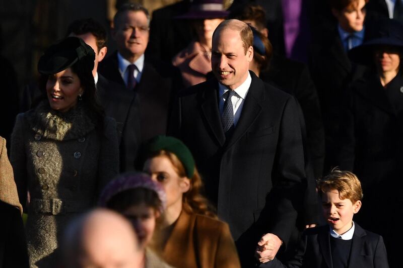 Britain's Catherine, Duchess of Cambridge, left, Britain's Prince William, Duke of Cambridge, centre, and Britain's Prince George of Cambridge, right, arrive for the Royal Family's traditional Christmas Day service at St Mary Magdalene Church. AFP