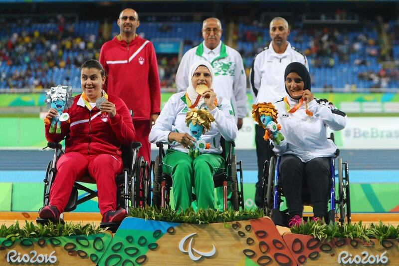 The UAE's Sara Al Senaani, right, poses with her bronze medal after a personal best throw secured third place in the shot put F33. Lucas Uebel / Getty Images