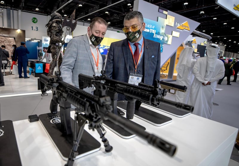 Abu Dhabi, United Arab Emirates, February 22, 2021.  Idex 2021 Day 2.
Visitors at the Israeli firearms company, EMTAN.
Victor Besa / The National
Section:  NA
Reporter:  John Dennehy