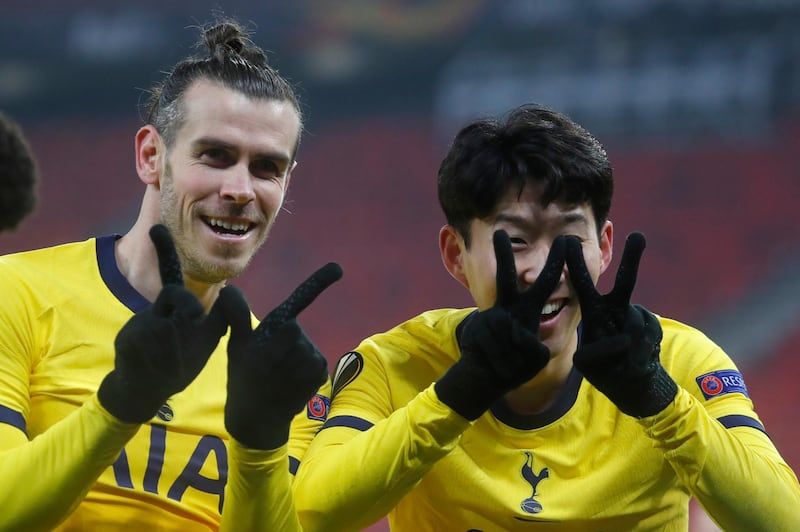 Tottenham's Son Heung-min, right, celebrates with Gareth Bale after scoring his side's first goal during their 4-1 Europa League last-32 win over Wolfsberger at the Puskas Arena in Budapest, on Thursday, February 18. AP