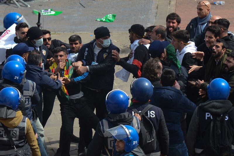 Turkish police detain a man during  a gathering of Turkish Kurds at Nowruz celebrations in Diyarbakir, southeastern Turkey. AFP