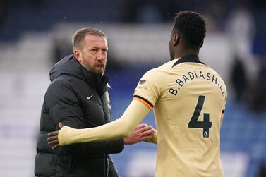 Chelsea manager Graham Potter greets Benoit Badiashile following the Premier League match at the King Power Stadium, Leicester. Picture date: Saturday March 11, 2023.