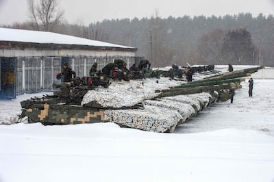 Tanks of the 92nd brigade of Ukrainian Armed Forces parked in their base near Klugino-Bashkirivka village, in the Kharkiv region on January 31, 2022. AFP