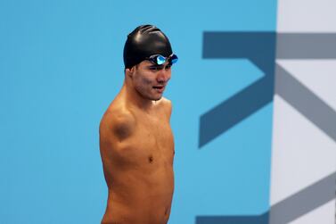 Refugee Paralympic Team's Afghan-origin Abbas Karimi leaves the pool after competing in the men's 50m butterfly S5 category heat during the Tokyo 2020 Paralympic Games at Tokyo Aquatics Centre in Tokyo on August 27, 2021.  (Photo by Behrouz MEHRI  /  AFP)