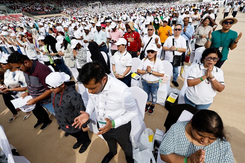 People attend a holy mass presided by Pope Francis at Bahrain National Stadium in Riffa, Bahrain. Reuters