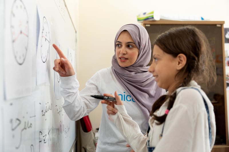 Unicef goodwill ambassador Muzoon Almellehan takes part in a mathematics accelerated learning class with 10-year-old Shahed while visiting the Unicef-supported Makani centre in East Amman, Jordan. All photos Unicef unless otherwise indicated