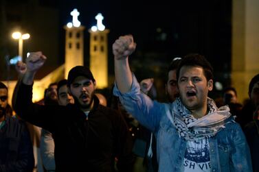 Protesters shout slogans as they block the main highway during ongoing anti-government protests near downtown in Beirut. EPA
