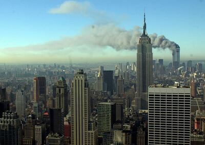 Smoke billows across the New York City skyline after two hijacked planes crashed into the twin towers on September 11, 2001. AP