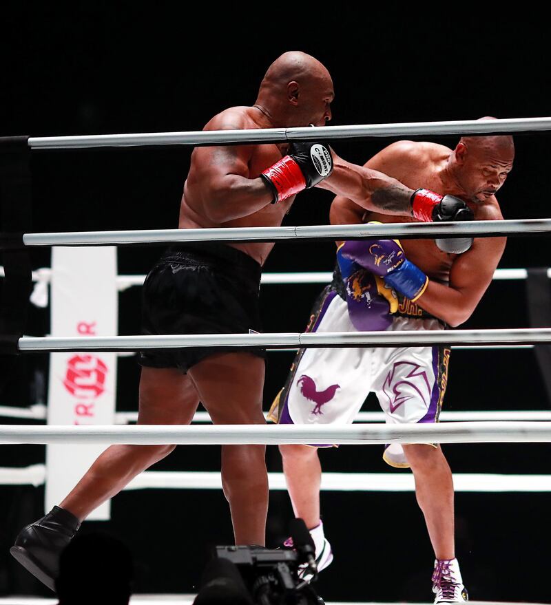 Mike Tyson  lands a punch on Roy Jones, Jr. during their heavyweight exhibition boxing bout. Reuters